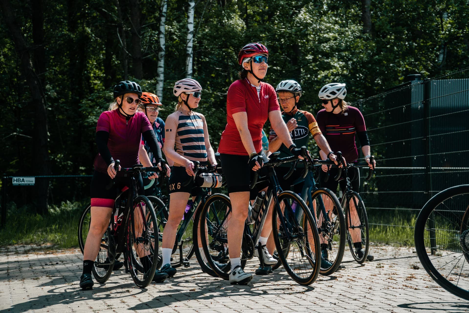 Cyclingwomen with their road bikes at a club ride in Nijverdal