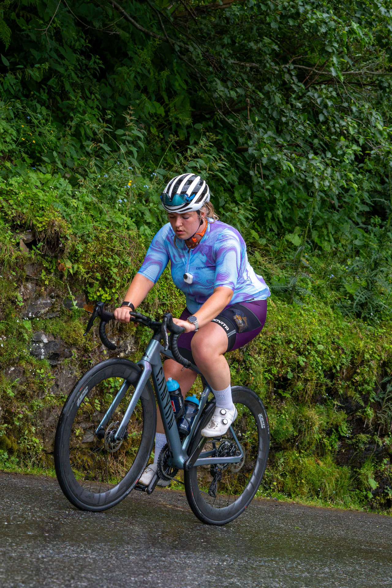 Participant cycling uphill during the Cyclingwomen trip to Austria, 2026