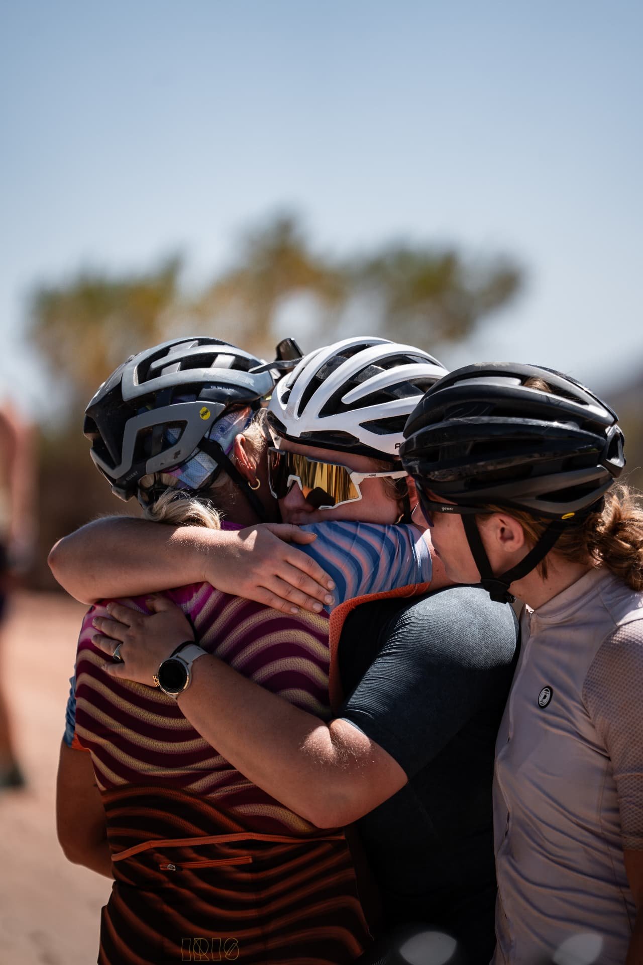 Cycling women hugging during a cycling trip